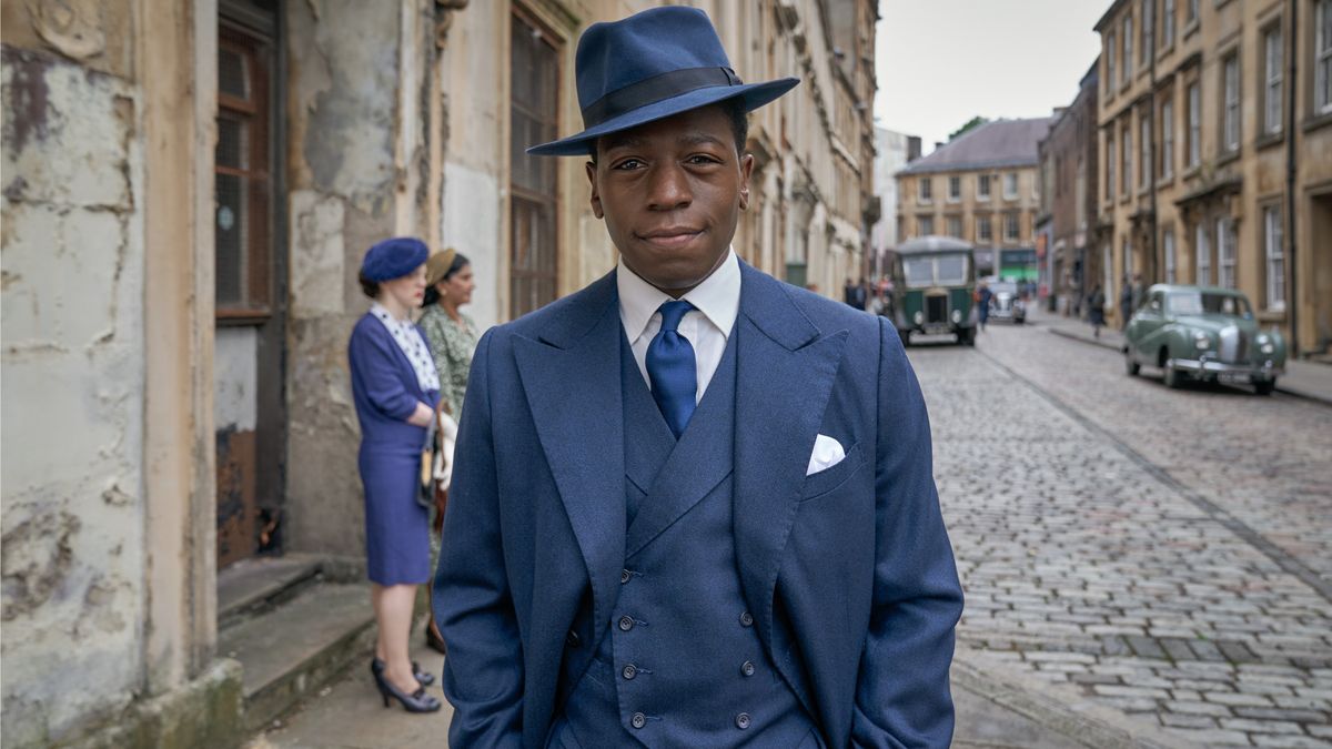 Luke Fitzwilliam (David Jonsson) in a blue three-piece suit in Agatha Christie&#039;s Murder is Easy