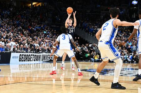 Braylon Mullins #24 of the UConn Huskies hits the game-winning shot in the second half against the Duke Blue Devils during the Elite Eight round game of the 2026 NCAA Men's Basketball Tournament held at Capital One Arena on March 29, 2026 in Washington, DC. 