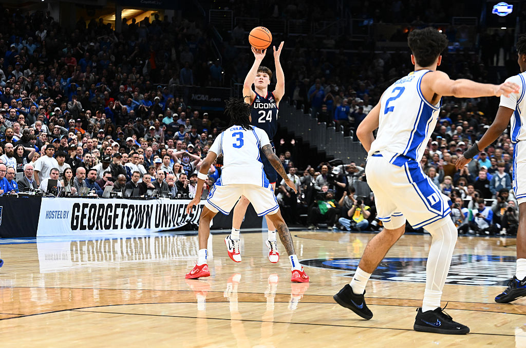 Braylon Mullins #24 of the UConn Huskies hits the game-winning shot in the second half against the Duke Blue Devils during the Elite Eight round game of the 2026 NCAA Men's Basketball Tournament held at Capital One Arena on March 29, 2026 in Washington, DC. 