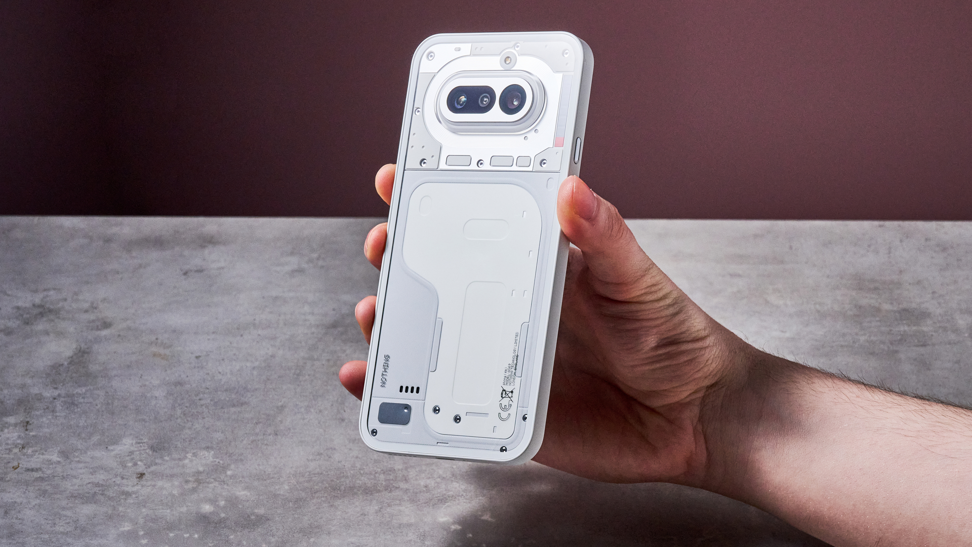 Man holding the Nothing Phone (4a)