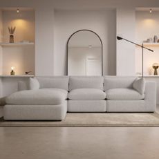 Photo of white modern sofa in living room