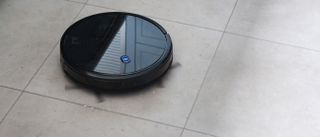 Eufy RoboVac 11S on a tiled floor