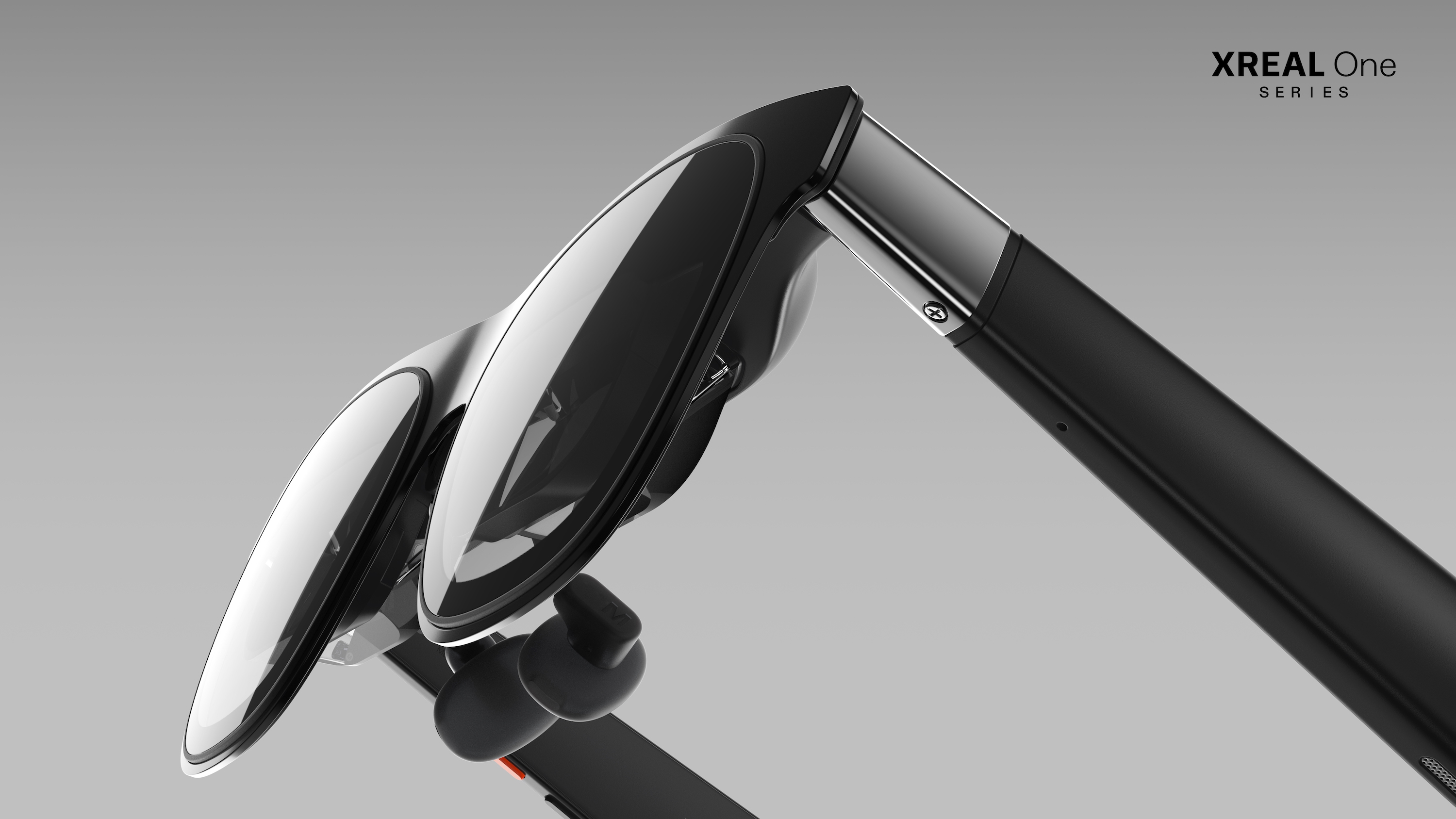 The Xreal One smart glasses close-up on a gray background