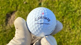 Photo of the Callaway Chrome Tour Golf Ball in hand