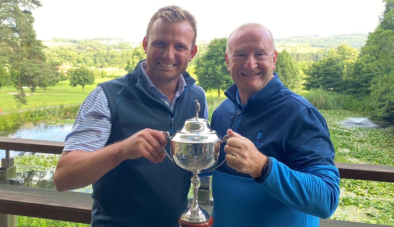 Lee Cattermole poses with a member holding a trophy