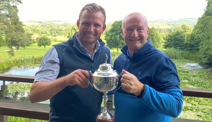 Lee Cattermole poses with a member holding a trophy