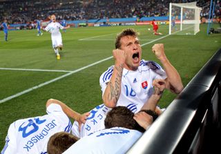 Slovakia players celebrate their second goal against Italy, scored by Robert Vittek, at the 2010 World Cup.