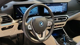 Steering wheel and large displays inside the BMW i4