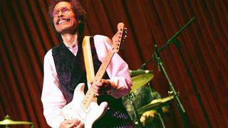 Shuggie Otis plays a reversed Stratocaster onstage in 2015