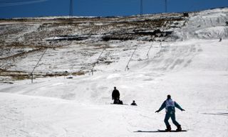 Skiers on a snow-covered slope at Afriski Mountain Resort in Lesotho