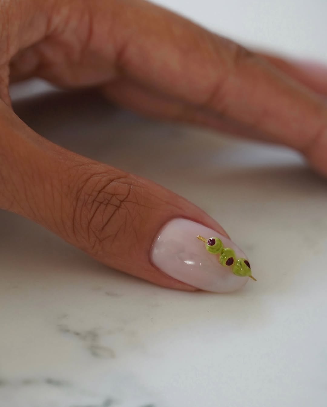 A simple and clean martini manicure by Iram Shelton