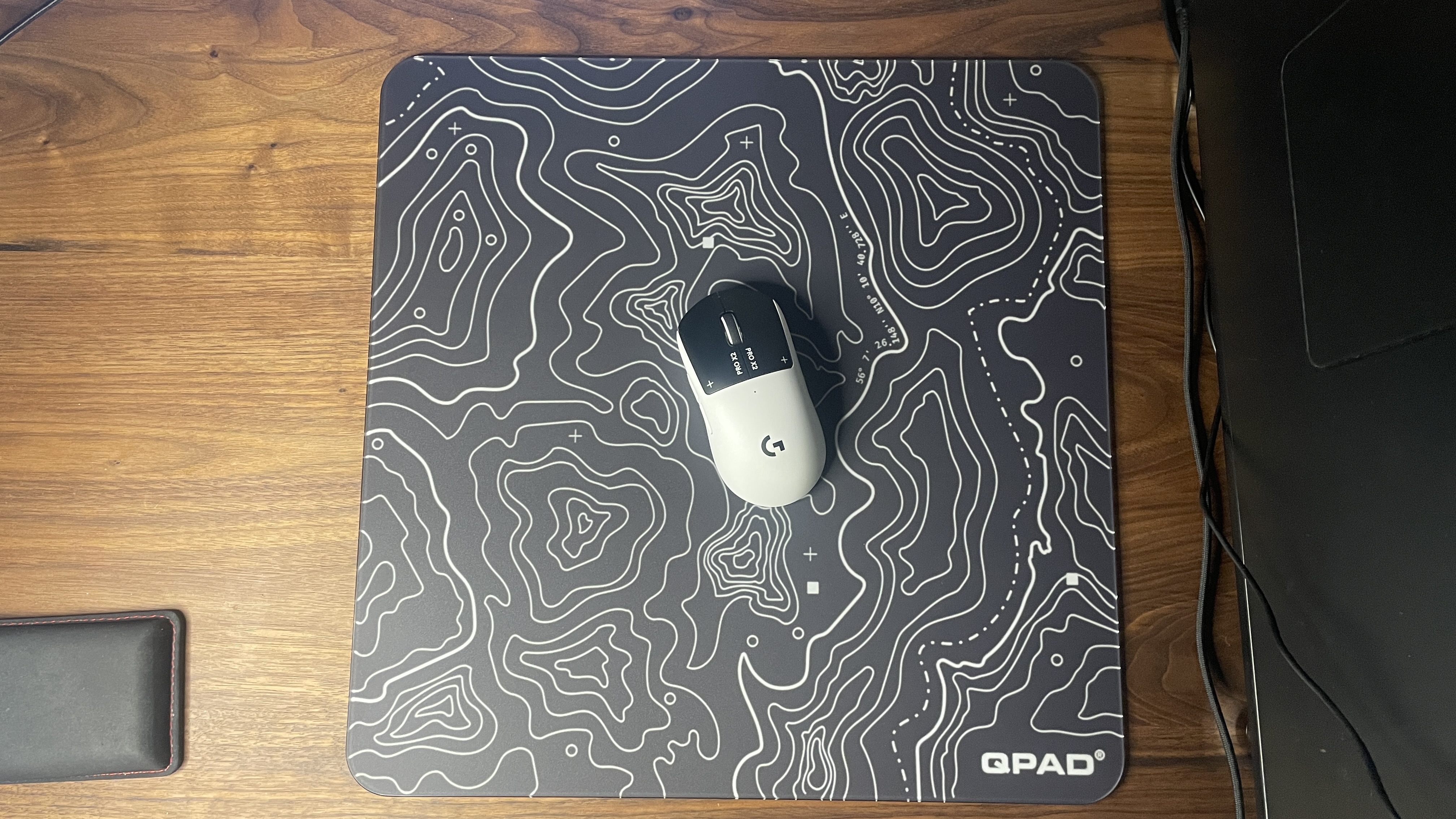 A QPAD Obsidian Glass mouse pad.