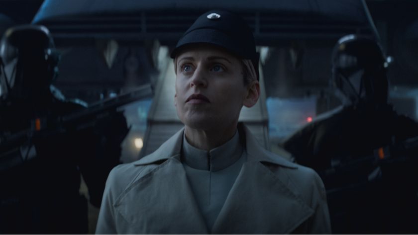 Denise Gough as Dedra Meero in Andor, flanked by some Imperial Death Troopers.
