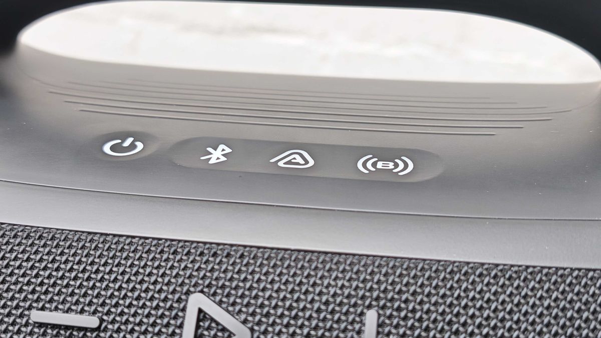The JBL Boombox 4 on a table outside.