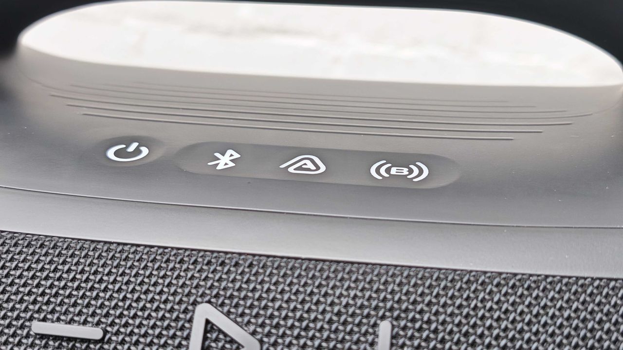The JBL Boombox 4 on a table outside.