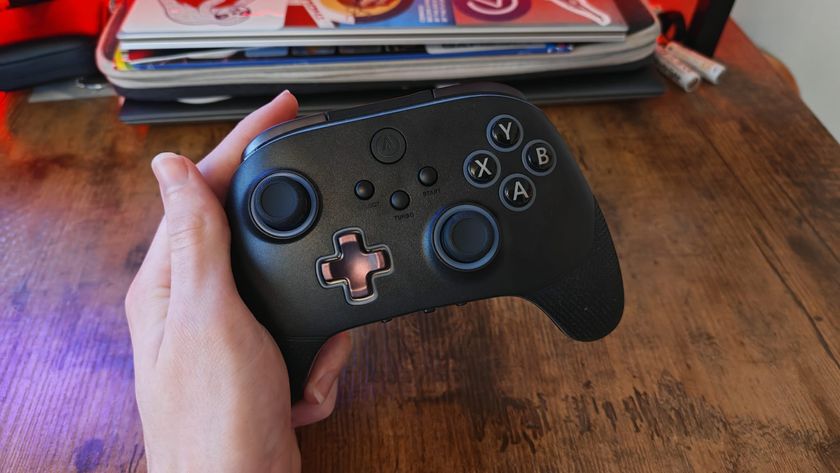 A reviewer holding the PowerA OPS V3