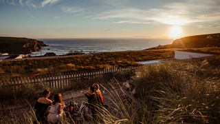 Sunsets over the sea in Cornwall from a vantage point at Bedruthan Hotel & Spa