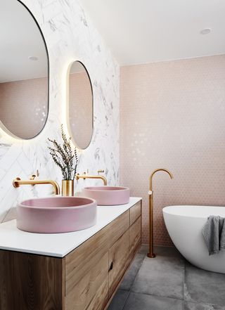 Norsu luxury bathroom with pink sinks and gold taps