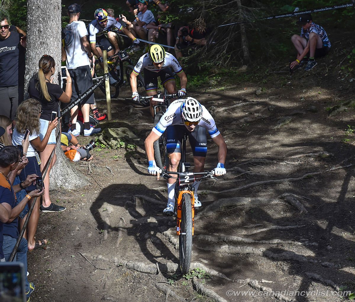Mathieu van der Poel (Corendon-Circus) leads Nino Schurter (Scott-SRAM MTB Racing) and Henrique Avancini (Cannondale Factory Racing) over the roots