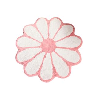 A pink and white flower rug
