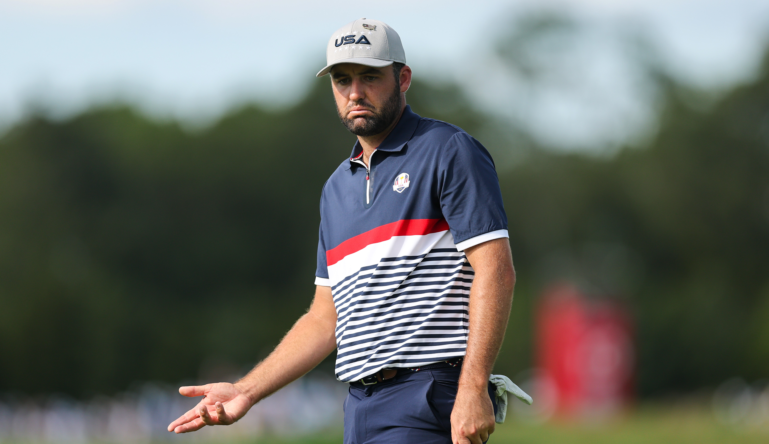 Scottie Scheffler reacts after a missed putt