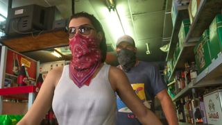 A screenshot of the GTA 6 Extended Look. Jason and Lucia wear handkerchiefs to conceal their identity as they commit crimes.