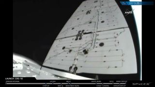 This still from a SpaceX webcast shows a solar array unfolding from the SpaceX-10 Dragon cargo ship after launching the company's 10th resupply mission for NASA on Feb. 19, 2017.