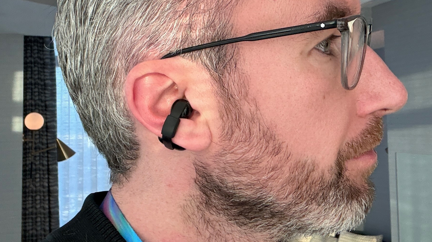 Sony LinkBuds Clip in a man's ear