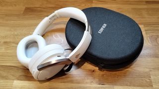 Edifier WH950NB review; cream coloured headphones on a grey case
