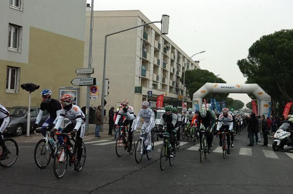 Riders are bundled up at the start of stage 2