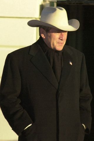President George Bush wearing a hat