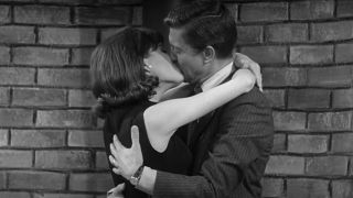 Dick Van Dyke and Mary Tyler Moore share a kiss in the living room in The Dick Van Dyke Show series finale.