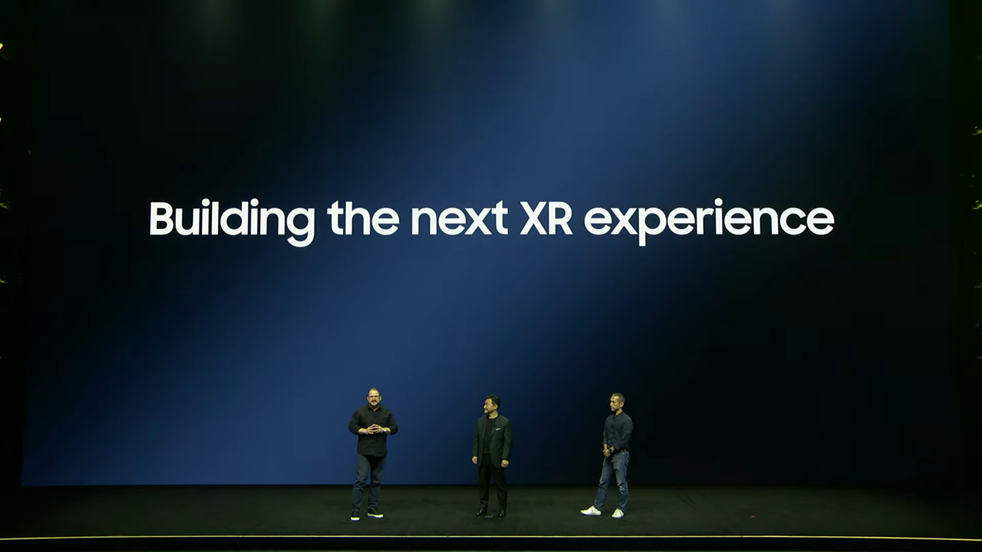 Three people on stage at Samsung Unpacked 2023 teasing Samsung's future of XR