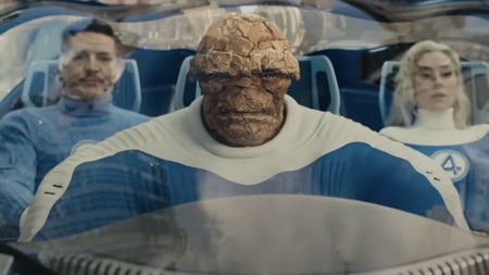 Thing driving the Fantasti-Car and Mister Fantastic and Invisible Woman sitting in the back seats