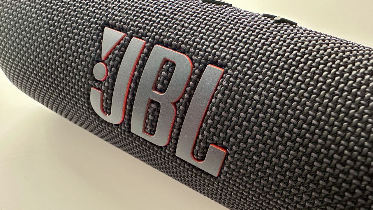 JBL Flip 7 portable Bluetooth speaker on a white surface