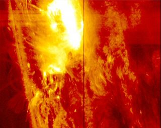 A solar flare erupts