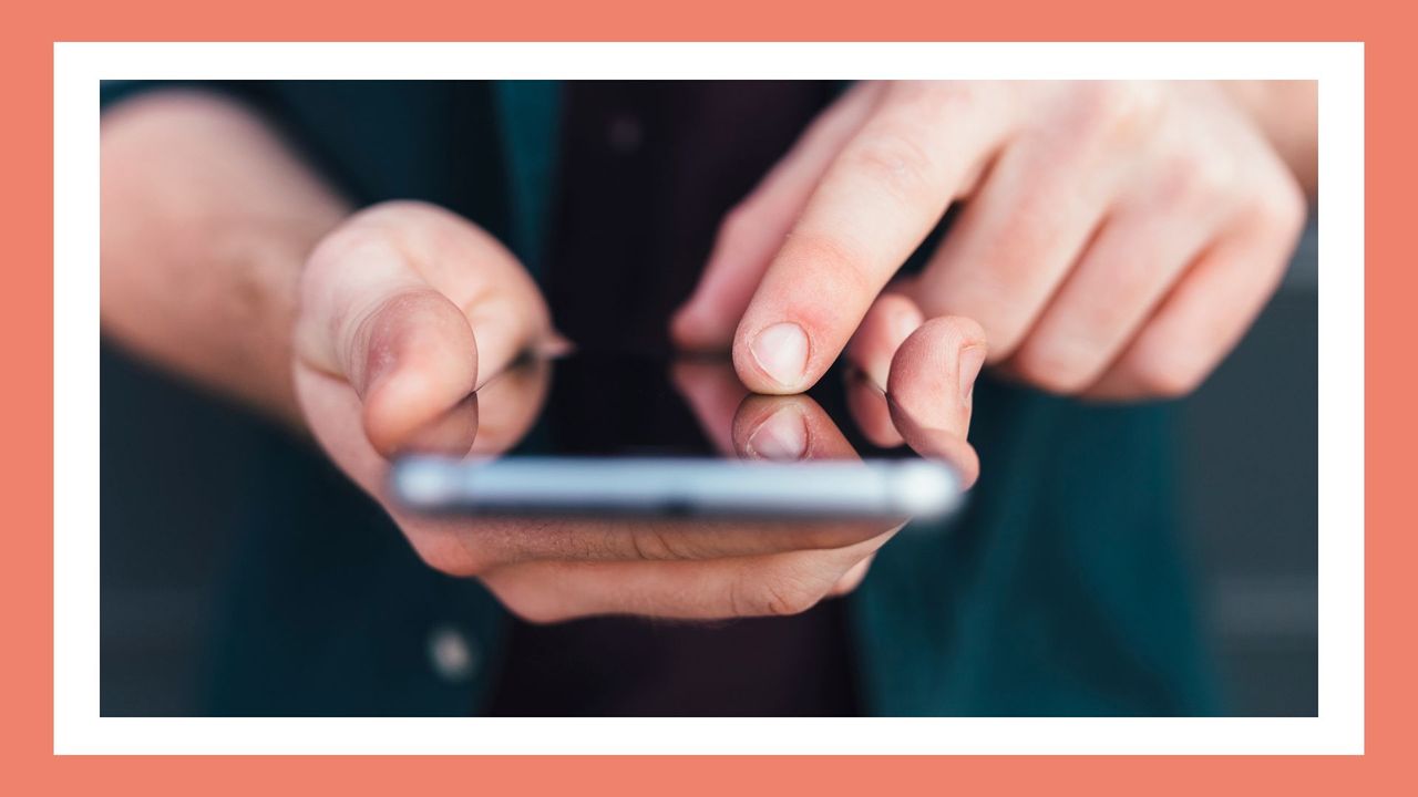 closeup of man&#039;s hands on a smartphone