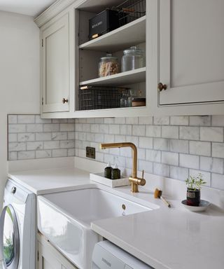 Mudroom with marble backsplash