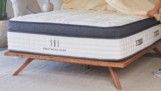 Brentwood Home bed with sheets on top
