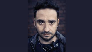 A headshot of director J.A. Bayona, who leads production on The Rings of Power