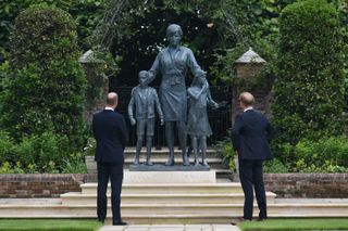Prince Harry and Prince William admiring Princess Diana statue