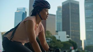 Woman cycling through city