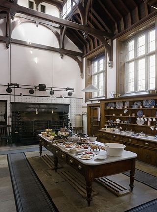 The Kitchen with the high gabled roof supported by great wooden trusses at Lanhydrock, Cornwall