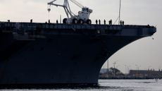 SAN DIEGO, CALIFORNIA - NOVEMBER 18: The U.S Navy USS Nimitz (CVN-68), the world's oldest nuclear-powered aircraft carrier sails out of San Diego Bay to the Pacific Ocean to perform readiness drills before returning its homeport of Naval Base Kitsap on November 18, 2024 in San Diego, California. The ship is scheduled to be decommissioned in fiscal 2026. 