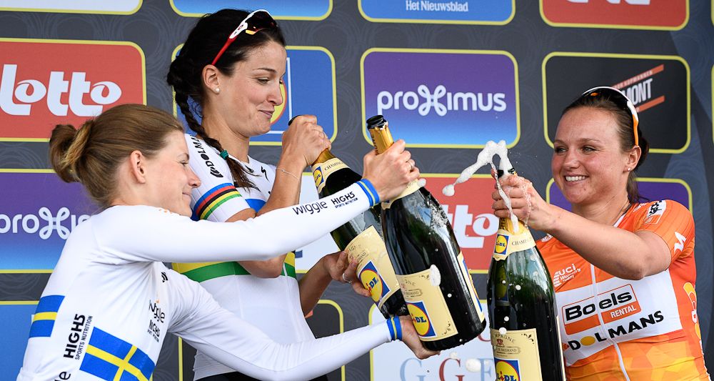 Emma Johansson, Elizabeth Armitstead and Chantal Blaak celebrate with champagne after the women's race at Ronde van Vlaanderen
