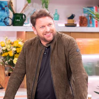 james martin with brown jacket and smiling