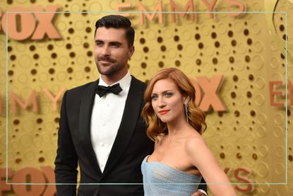 a close up of Brittany Snow and her husband Tyler Stanaland posing on the red carpet at the Emmys 2019