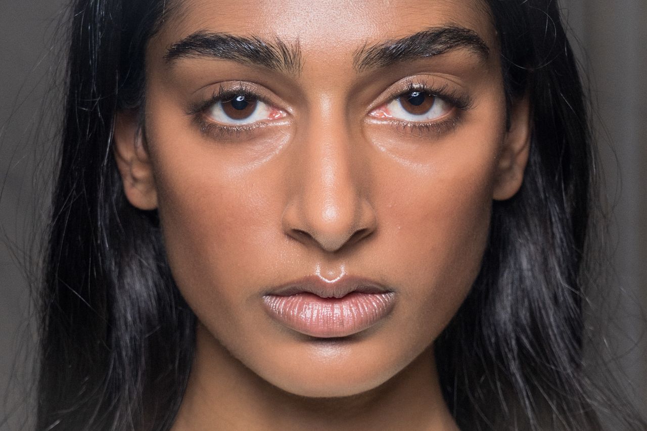Three women with bronzed makeup