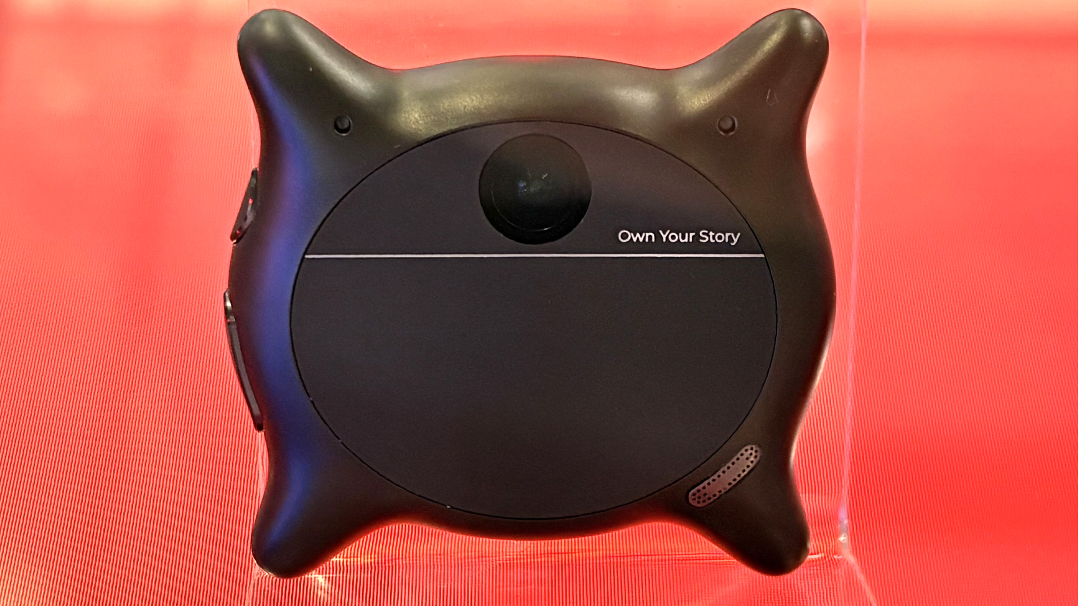 The Looki L1 AI pin shown at the Snapdragon booth at Mobile World Congress 2026