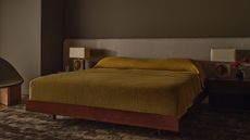 Modern bedroom with dark brown walls.